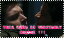 close up of castiel pushing dean winchester against wall captioned THIS USER IS VERITABLY INSANE
